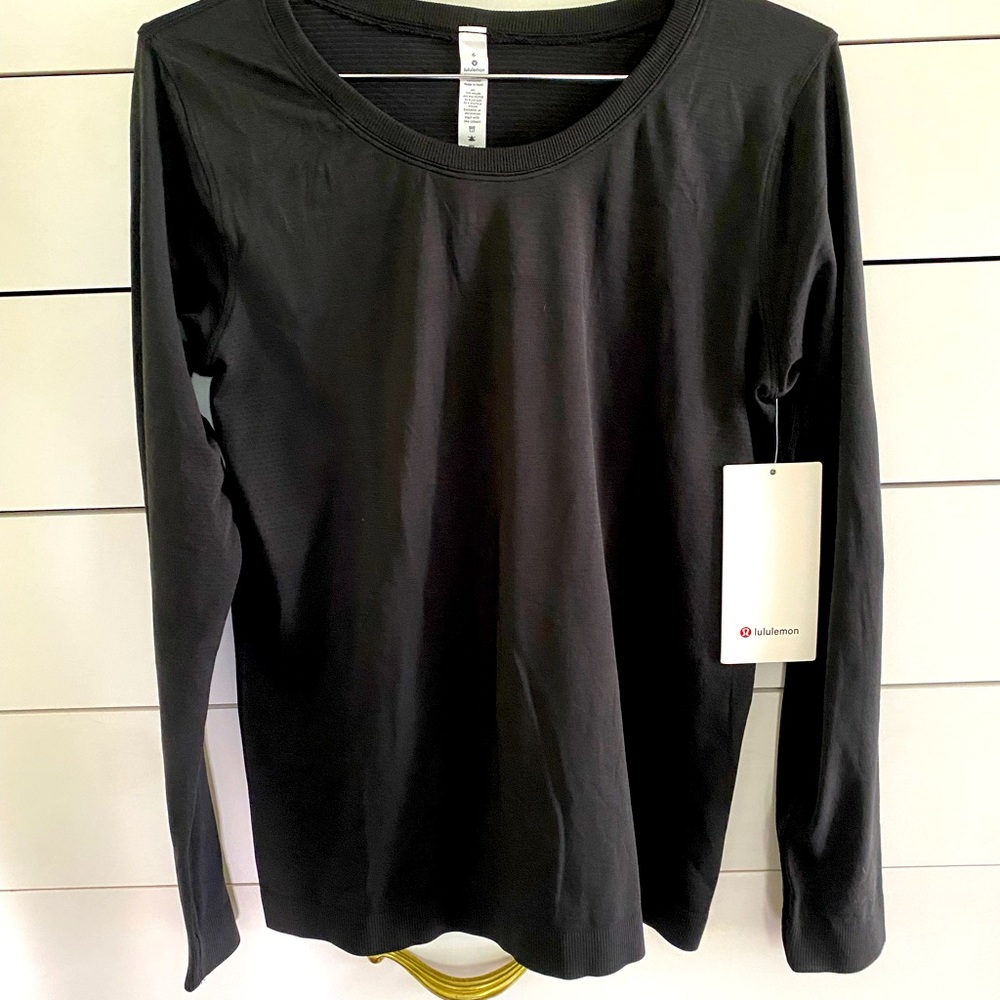 Lululemon New with tags Long sleeve black workout shirt.